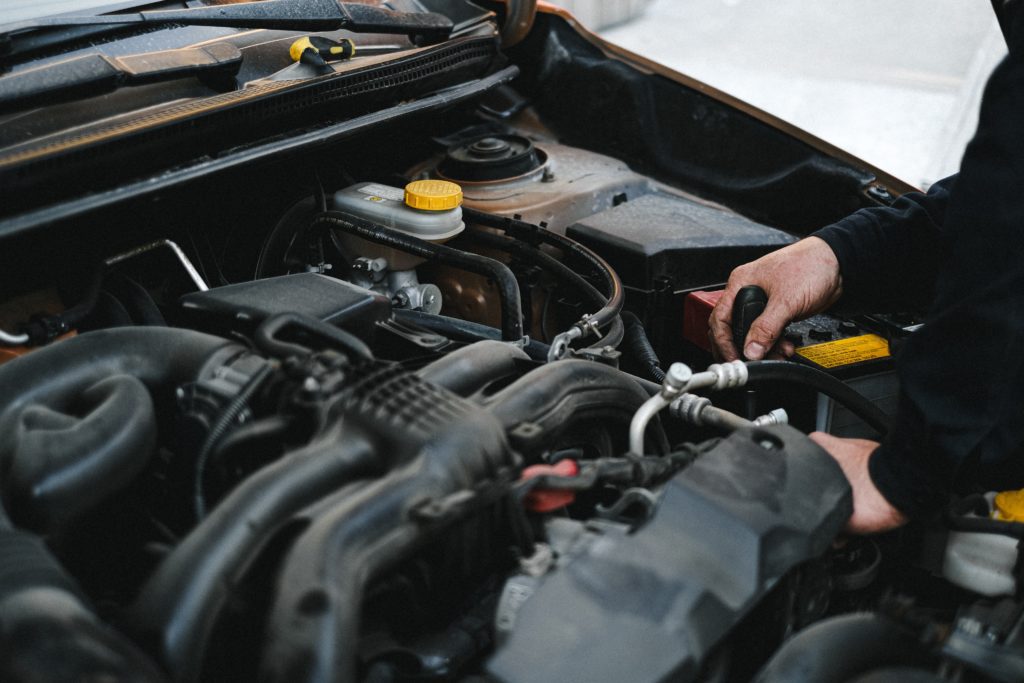 Mechanic hand working on engine